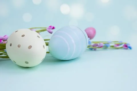 Easter composition. Decorative eggs on a blue background, copy space. Stock Photos