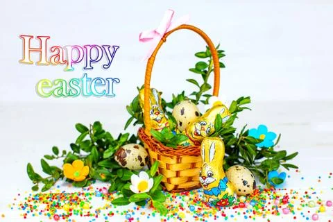 Easter composition. Easter cake and painted eggs, white flowers, festive comp Stock Photos