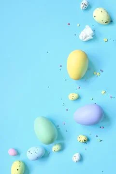 Easter composition. Easter eggs and easter bunny on pastel blue background. M Stock Photos