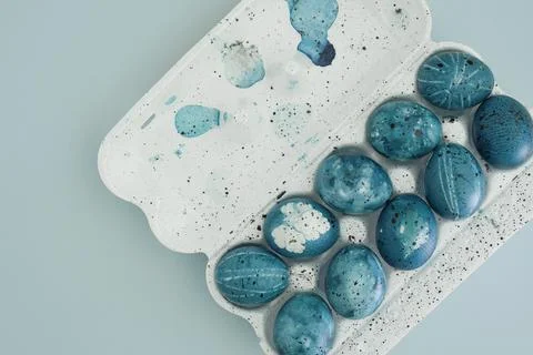 Easter composition of easter eggs in blue color of night sky on trendy yellow Stock Photos