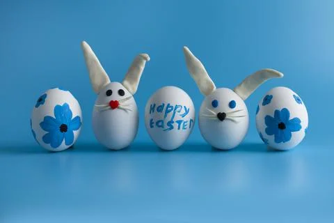 Easter composition with Easter eggs decorated flowers and Easter bunny. Stock Photos