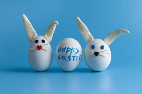 Easter composition with Easter eggs decorated flowers and Easter bunny. Stock Photos