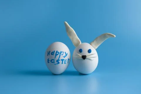 Easter composition with Easter eggs decorated flowers and Easter bunny. Stock Photos