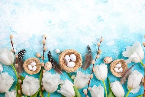 Easter composition with Easter eggs in nest,pussy willow branches and white.. Stock Photos