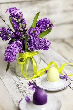 Easter composition with egg and egg cup with Hyacinth spring flowers on woode Stock Photos