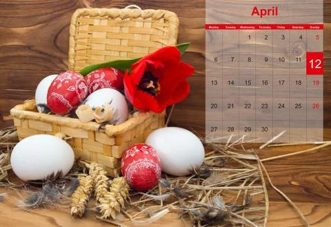 Easter composition with eggs and flower tulip in a basket with a calendar for Stock Photos