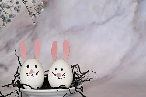 Easter composition of eggs and flowers on a light background. Easter bunny. A Stock Photos
