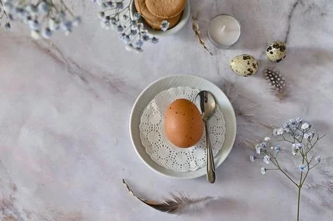 Easter composition of eggs and flowers on a light background. Easter bunny. A Stock Photos