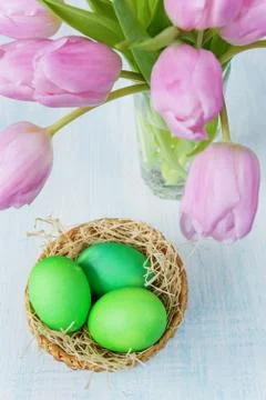 Easter composition with eggs and tulips Stock Photos