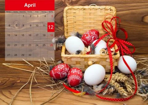 Easter composition with eggs  in a basket with a calendar for april 2015. Stock Photos