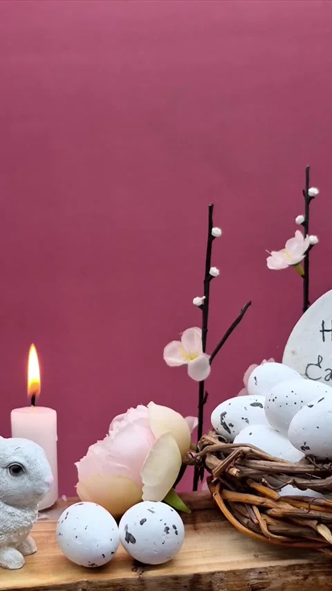 Easter composition with eggs, candle and bunny Video stock 304758856