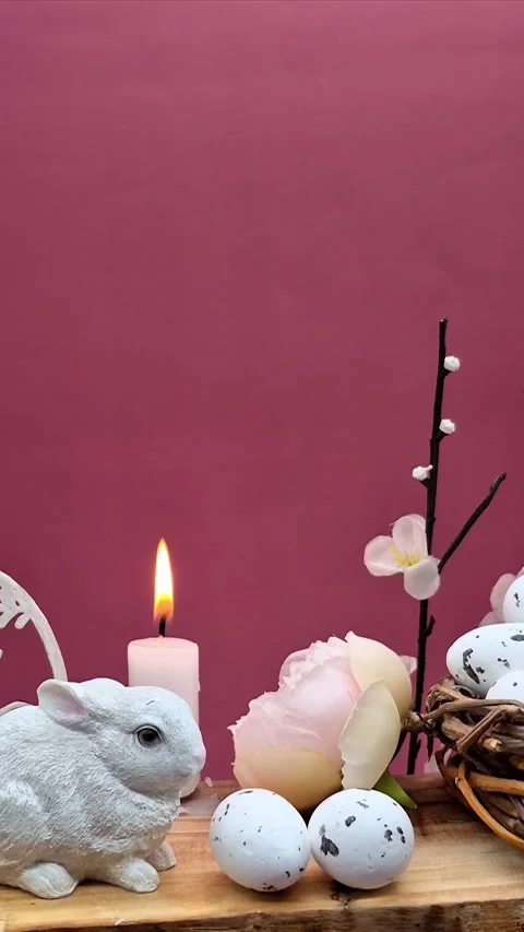 Easter composition with eggs, candle and bunny Video stock 304758896