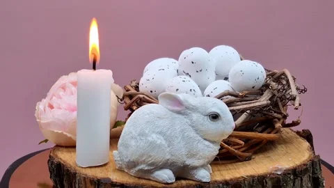 Easter composition with eggs, candle and bunny Stock Footage 304758920