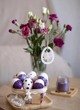 Easter composition with eggs, decorated with purple sparkles. Stock Photos