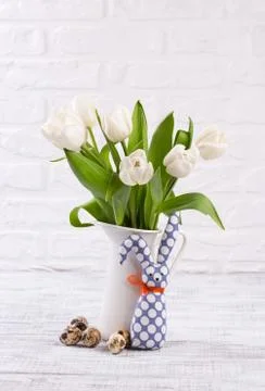 Easter composition with eggs, spring tulips and handmade easter bunny on old  Stock Photos