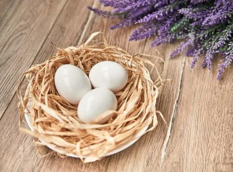 Easter composition with eggs on wooden background, space for text Stock Photos