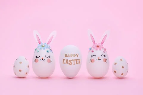Easter composition of five different eggs on a pink background. Stock Photos