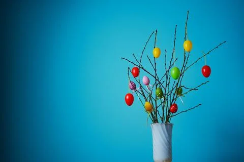 Easter composition. Front view of a white vase with a branch Stock Photos