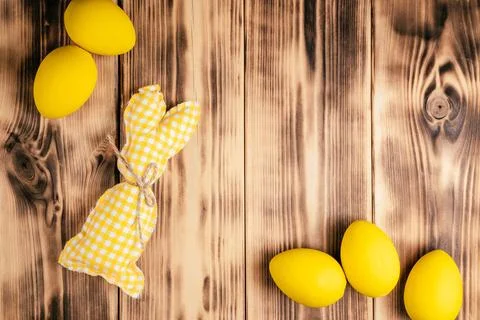 Easter composition of greeting postcard holiday. Yellow colored chicken egg.. Stock Photos