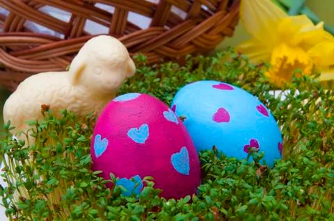 Easter composition - hand painted eggs and chocolate lamb Stock Photos