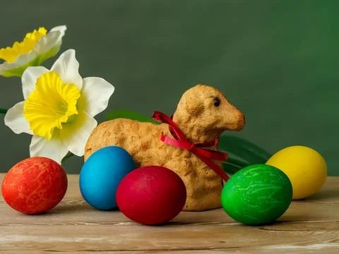 Easter composition, lamb made of bread, eggs painted in different colors Stock Photos