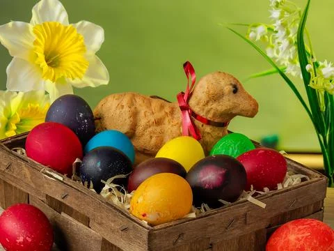 Easter composition, lamb made of bread, eggs painted in different colors Stock Photos
