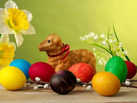 Easter composition, lamb made of bread, eggs painted in different colors Stock Photos