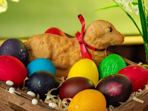 Easter composition, lamb made of bread, eggs painted in different colors Stock Photos