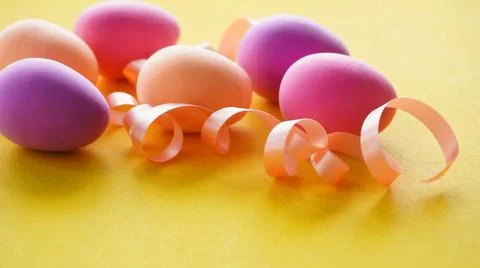 Easter composition with painted chicken eggs in different colors in a white plat Fotos de archivo