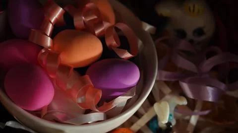 Easter composition with painted chicken eggs in different colors in a white plat 스톡 사진