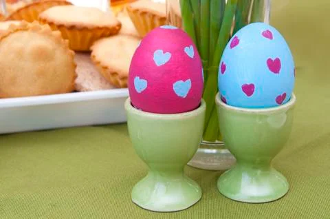 Easter composition - painted eggs and pastry Stock Photos