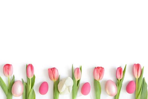 Easter composition with pink tulips, eggs and an Easter bunny Stock Photos
