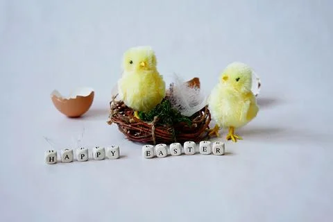 Easter composition with plush chicks and cubes with the inscription "Happy .. Stock Photos