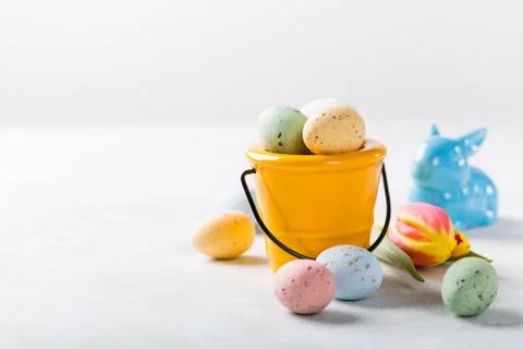 Easter composition with quail eggs and tulips Stock Photos