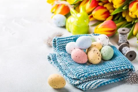 Easter composition with quail eggs and tulips Stock Photos