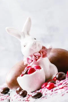 Easter composition with a rabbit and eggs, gray background, selective focus Stock Photos