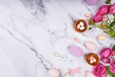 Easter Composition with Roses and Pastel Eggs Stock Photos