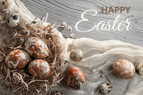 Easter composition - several marble eggs painted with natural dyes in a paper Stock Photos