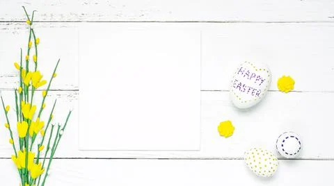 Easter composition spring flowers eggs on white background. Stock Photos