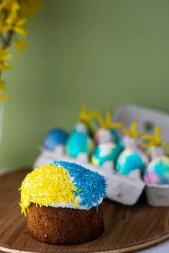 Easter composition with yellow-blue Easter cakes, sprinkles, Easter multi-col Stock Photos