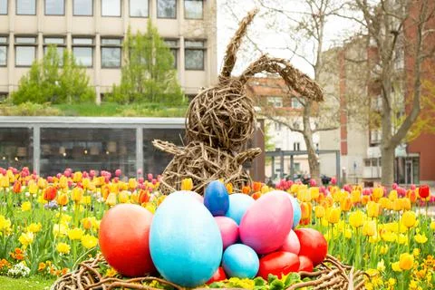 Easter concept. basket with Easter eggs on the grass. against the backdrop of Stock Photos