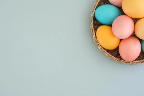 Easter concept on blue background with space for text. Basket with Easter Stock Photos