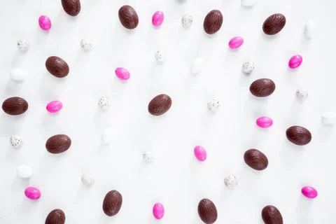 Easter concept - close up of eggs and sweets over white Stock Photos
