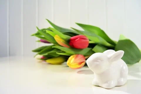 Easter concept, spring tulips and porcelain bunny Stock-Fotos