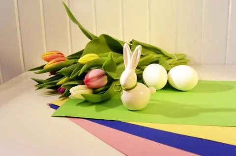 Easter concept, spring tulips and porcelain bunny Stock Photos