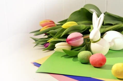 Easter concept, spring tulips and porcelain bunny Foto stock