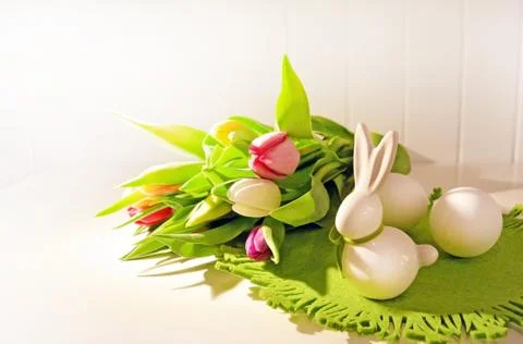Easter concept, spring tulips and porcelain bunny Stock Photos