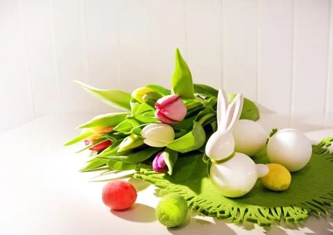 Easter concept, spring tulips and porcelain bunny Foto stock