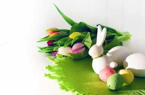 Easter concept, spring tulips and porcelain bunny Stock Photos