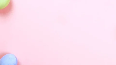 Easter concept stop motion. Egg make frame frome center, pink background Video stock 126720604